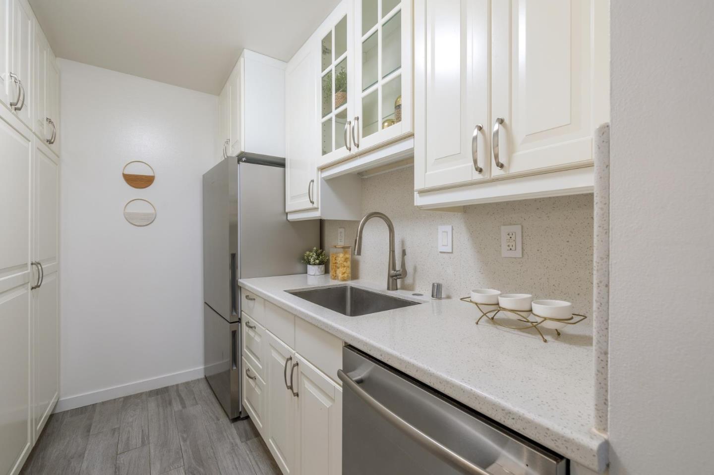 360 Vallejo Drive, Unit 98 Millbrae, CA 94030 - Photo 11 of 32 a kitchen with a sink and cabinets
