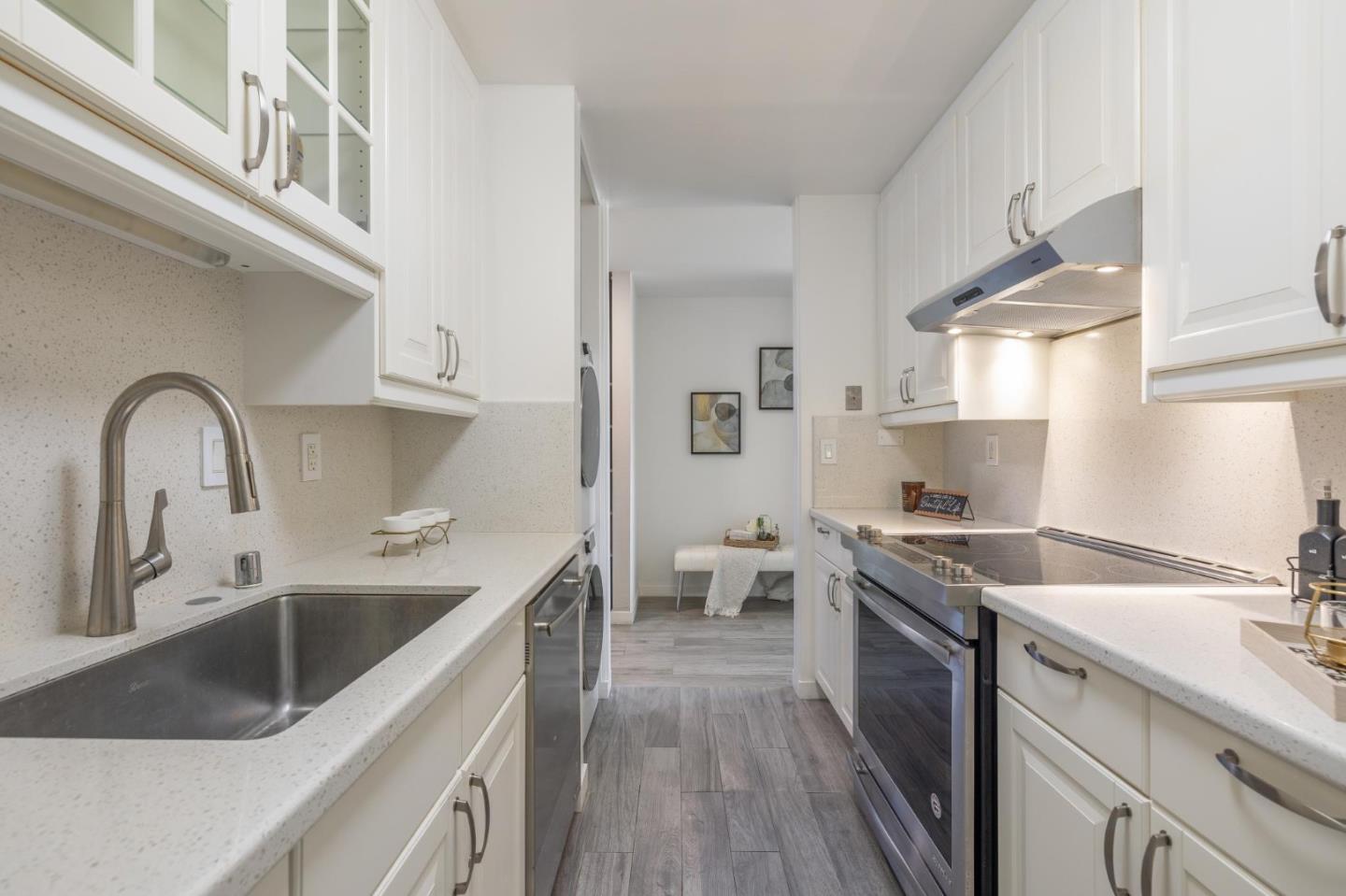 360 Vallejo Drive, Unit 98 Millbrae, CA 94030 - Photo 12 of 32 a kitchen with a sink stove and cabinets