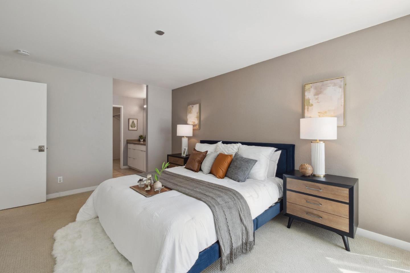 360 Vallejo Drive, Unit 98 Millbrae, CA 94030 - Photo 15 of 32 a bedroom with a bed and a night stand