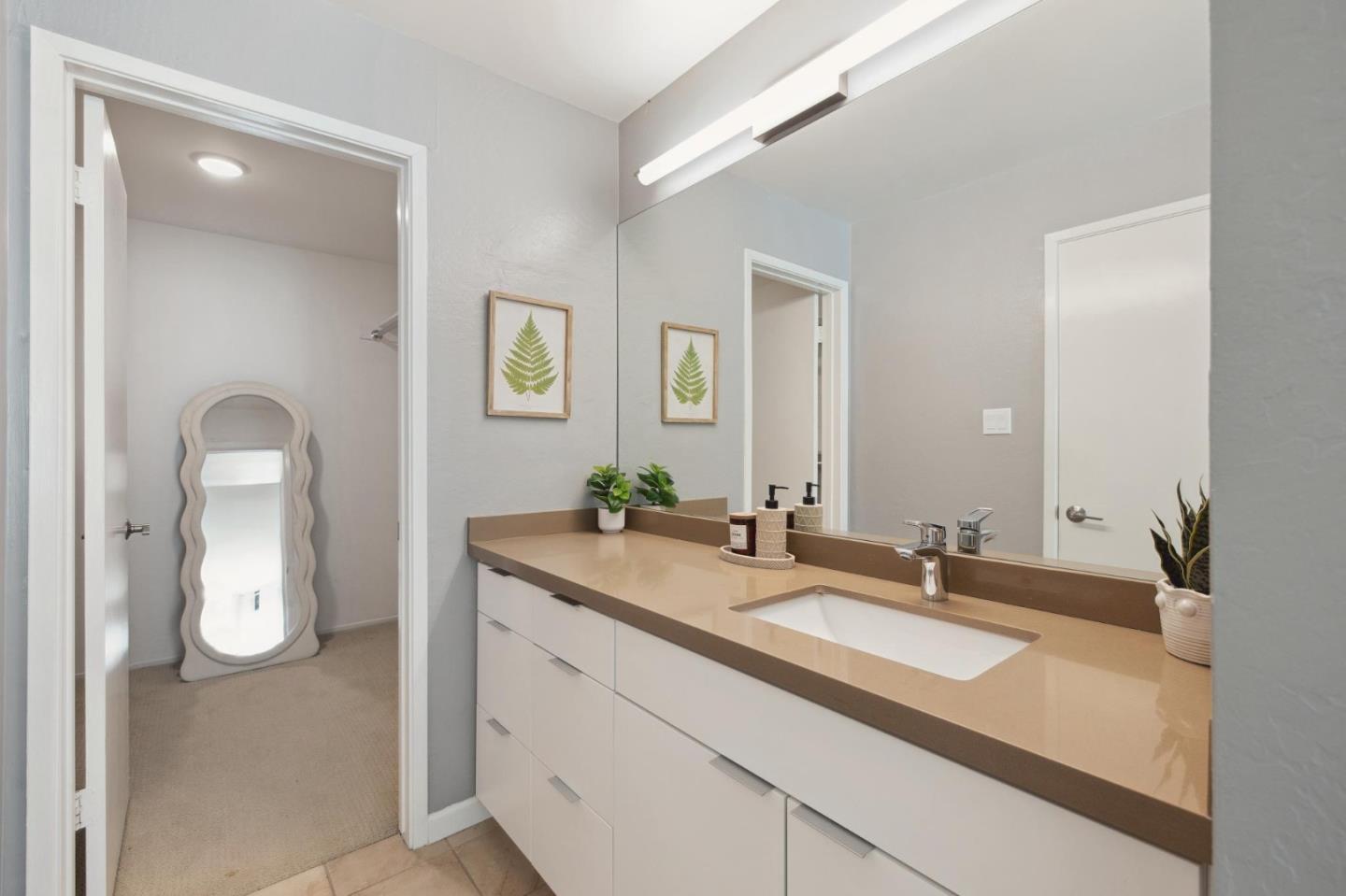 360 Vallejo Drive, Unit 98 Millbrae, CA 94030 - Photo 17 of 32 a bathroom with a sink and a mirror