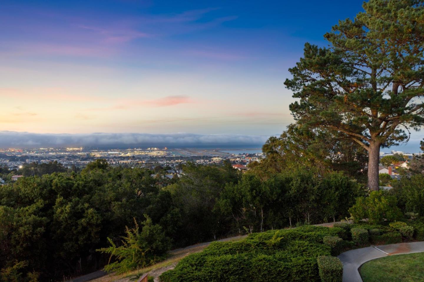 360 Vallejo Drive, Unit 98 Millbrae, CA 94030 - Photo 26 of 32 a view of a city with lush green forest