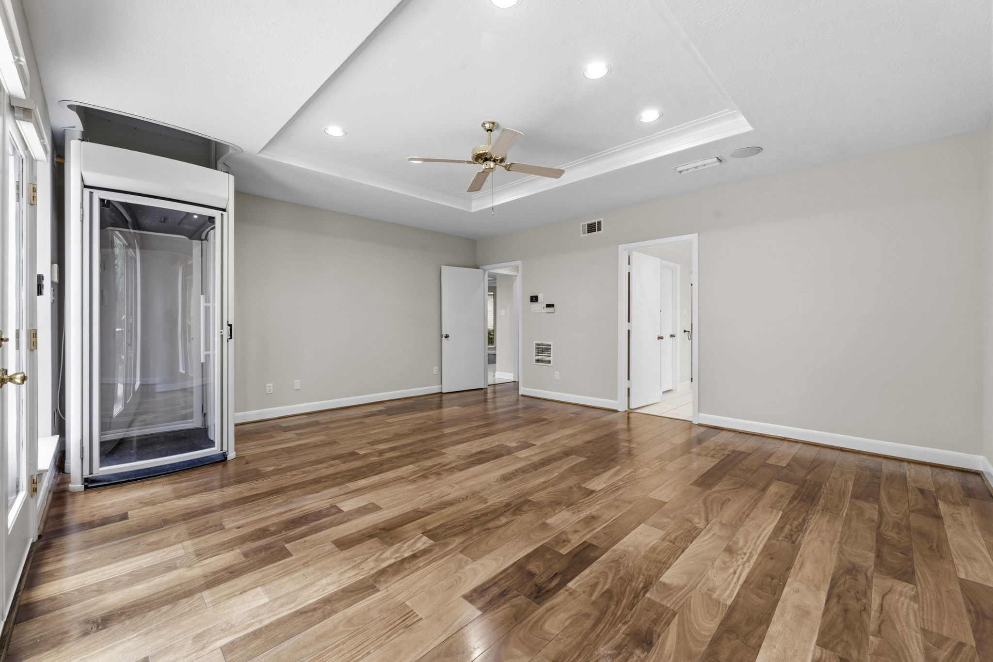 18503 Cabaniss Circle Spring, TX 77379 - Photo 24 of 49 A spacious owner's retreat featuring hardwood floors, recessed lighting, surround sound speakers, and direct access to the primary bath.