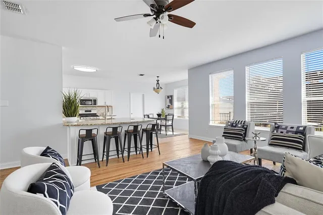 a living room with furniture and a large window