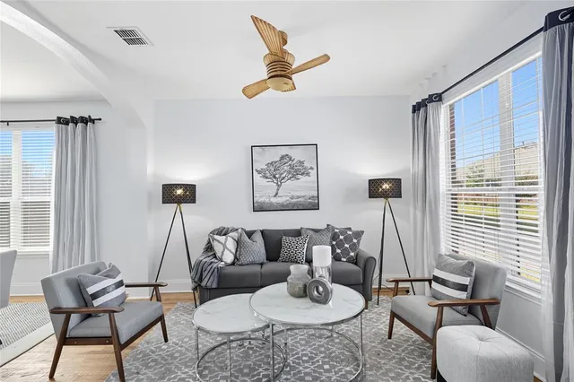 a living room with furniture and a large window