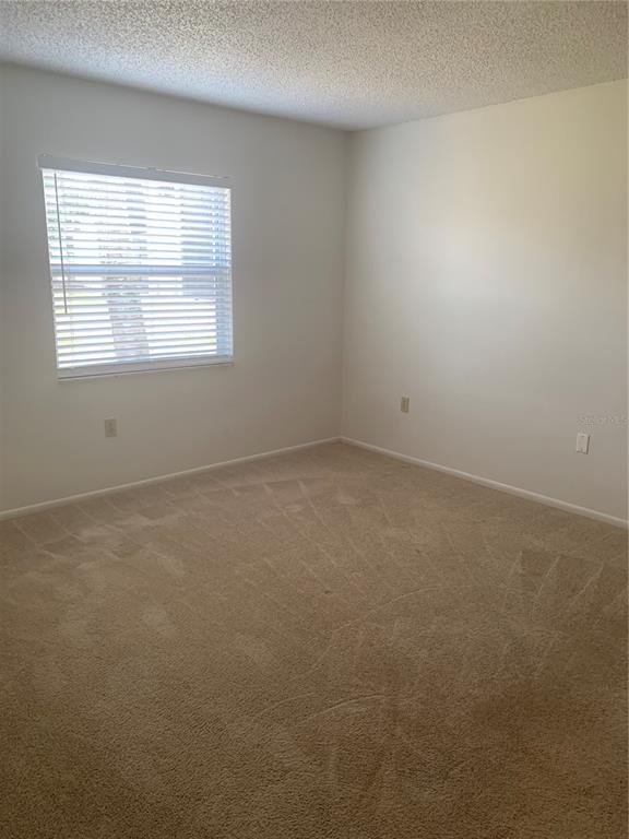 3223 South Beneva Road, Unit 103 Sarasota, FL 34232 - Photo 12 of 17 an empty room with a window