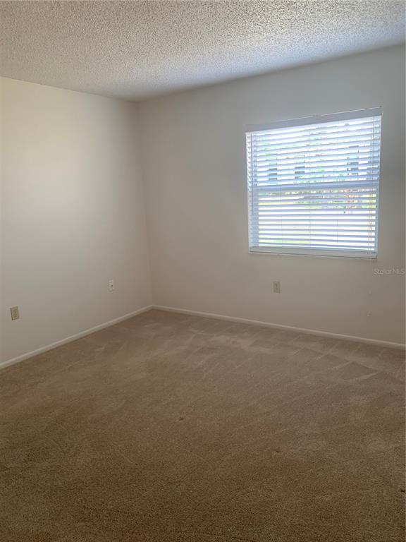 3223 South Beneva Road, Unit 103 Sarasota, FL 34232 - Photo 15 of 17 an empty room with a window