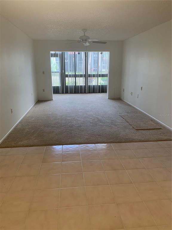 3223 South Beneva Road, Unit 103 Sarasota, FL 34232 - Photo 4 of 17 an empty room with windows