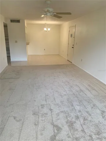 a kitchen with stainless steel appliances granite countertop a sink and a refrigerator