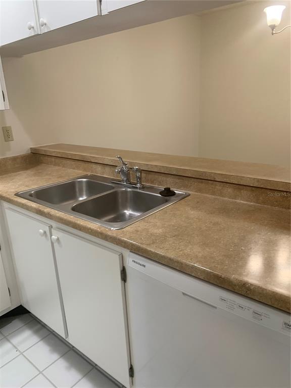 3223 South Beneva Road, Unit 103 Sarasota, FL 34232 - Photo 7 of 17 a close view of sink and tap