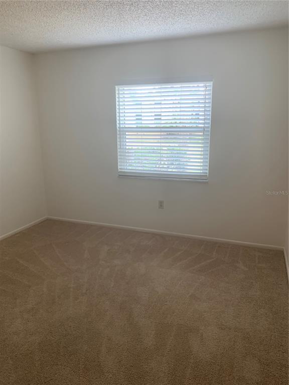 3223 South Beneva Road, Unit 103 Sarasota, FL 34232 - Photo 8 of 17 a view of an empty room with a window