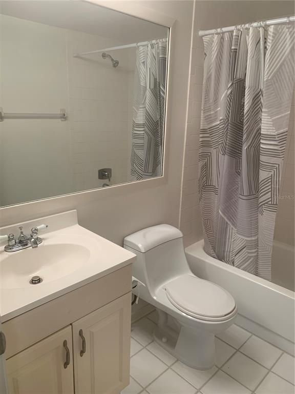 3223 South Beneva Road, Unit 103 Sarasota, FL 34232 - Photo 10 of 17 a bathroom with a sink a toilet and shower