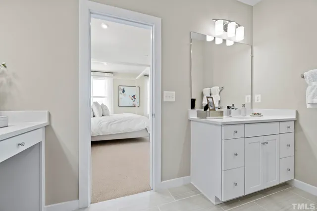 a view of a hallway with paintings on the wall