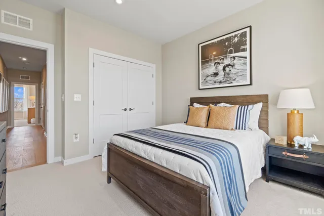 a green field with trees in the background