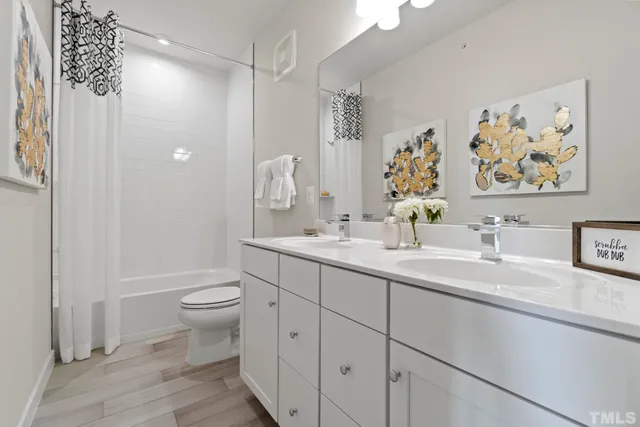 a street sign on a sidewalk next to a building