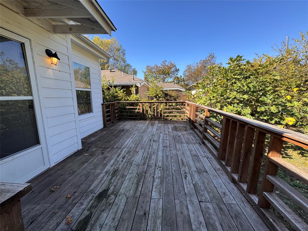 2547 Sharon Street Dallas, TX 75211 - Photo 11 of 22 a view of deck in front of house with wooden floor