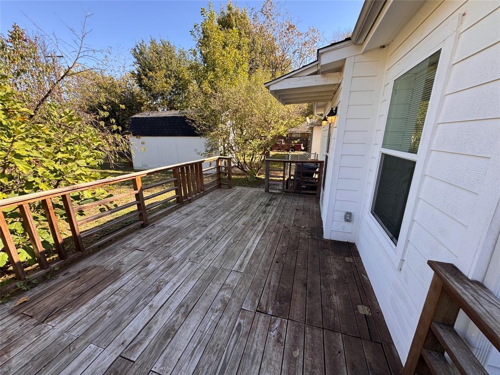 2547 Sharon Street Dallas, TX 75211 - Photo 22 of 22 a view of outdoor roof deck with wooden floor and seating space