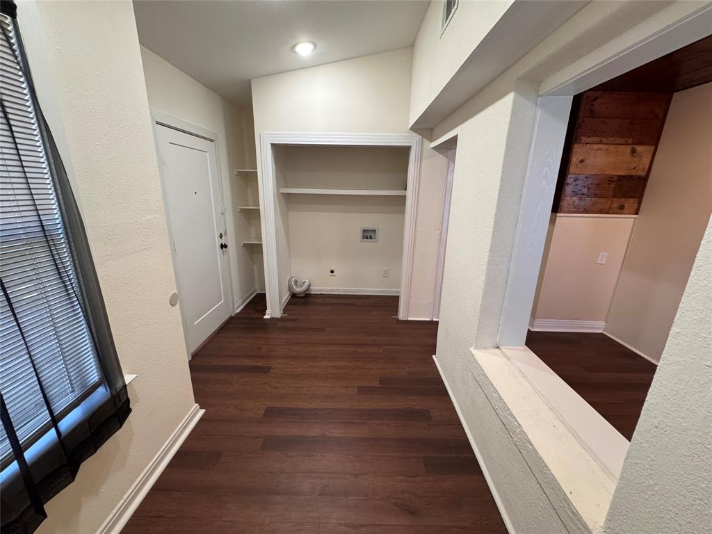 2547 Sharon Street Dallas, TX 75211 - Photo 10 of 22 a view of a hallway with wooden floor and staircase