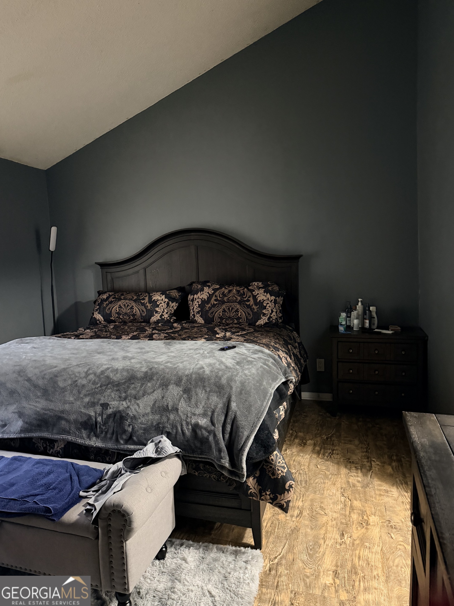 3484 Blazing Pine Path Decatur, GA 30034 - Photo 3 of 10 a bedroom with a bed and a lamp on dresser