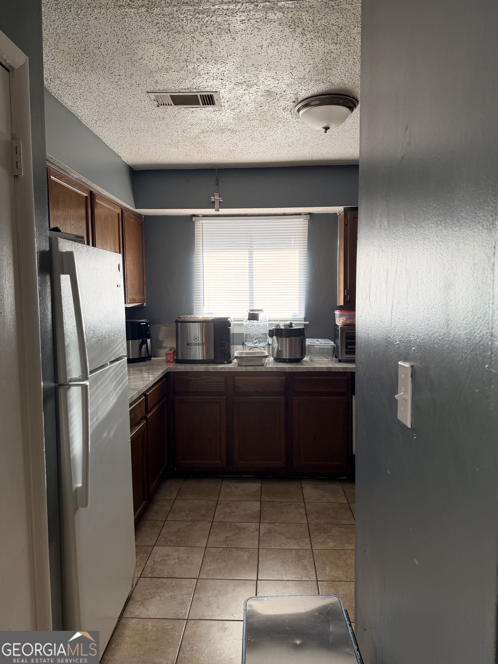 3484 Blazing Pine Path Decatur, GA 30034 - Photo 8 of 10 a kitchen with a sink a refrigerator and window