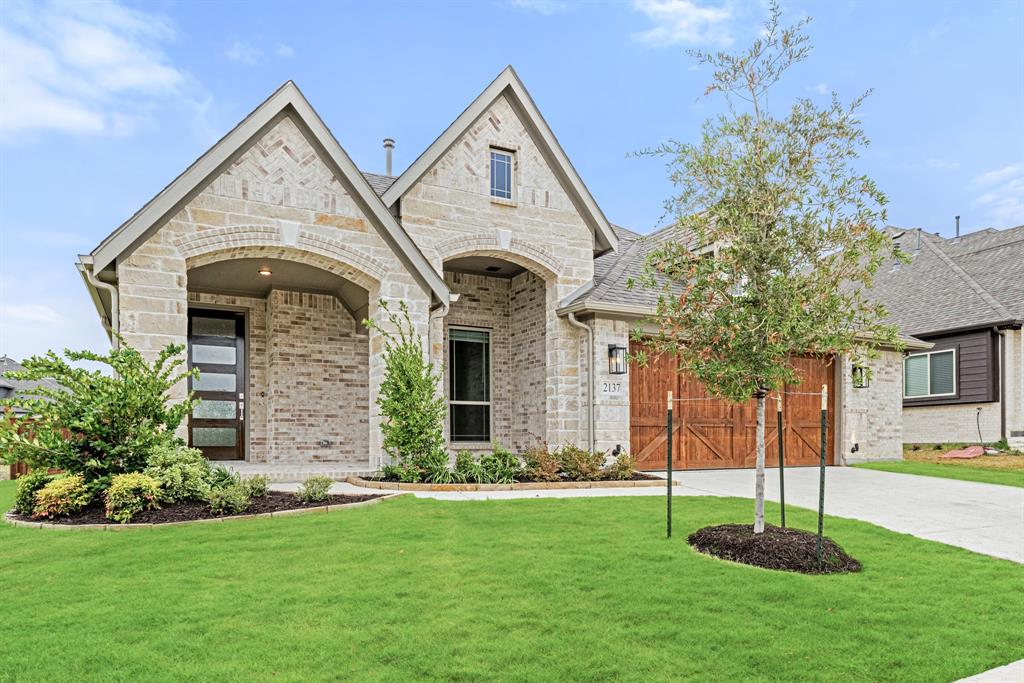 2137 Charming Frg Road Forney, TX 75126 - Photo 1 of 1 a front view of a house with a yard