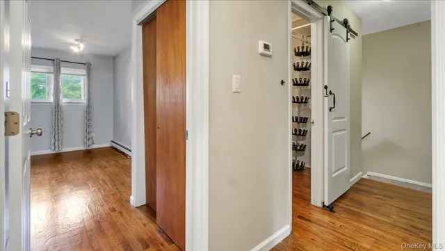 a view of room with window and hardwood floor