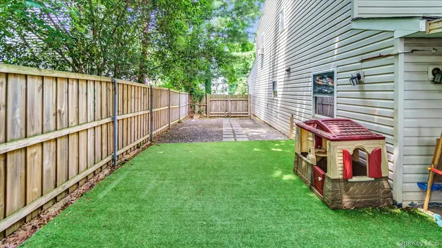 a view of a porch with a table and chairs
