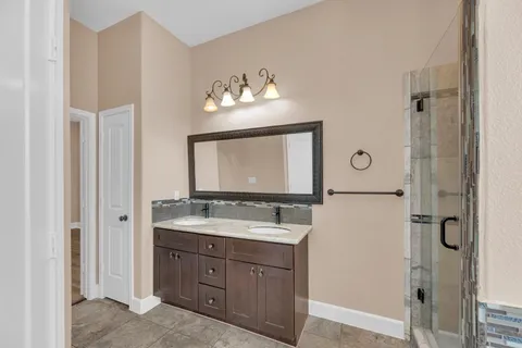 a bathroom with a tub and a window