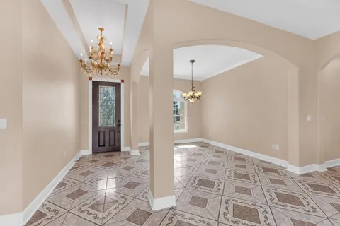 a view of an entryway with a chandelier