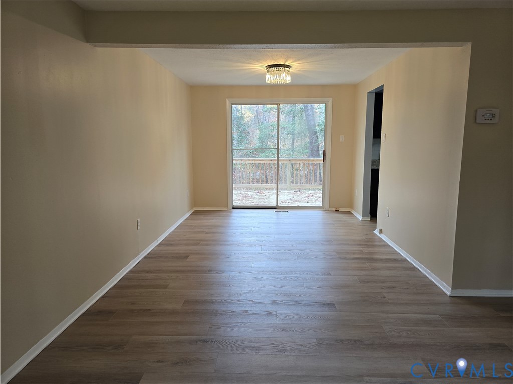 4600 Painted Post Lane Midlothian, VA 23112 - Photo 19 of 44 a view of an empty room with wooden floor and a window