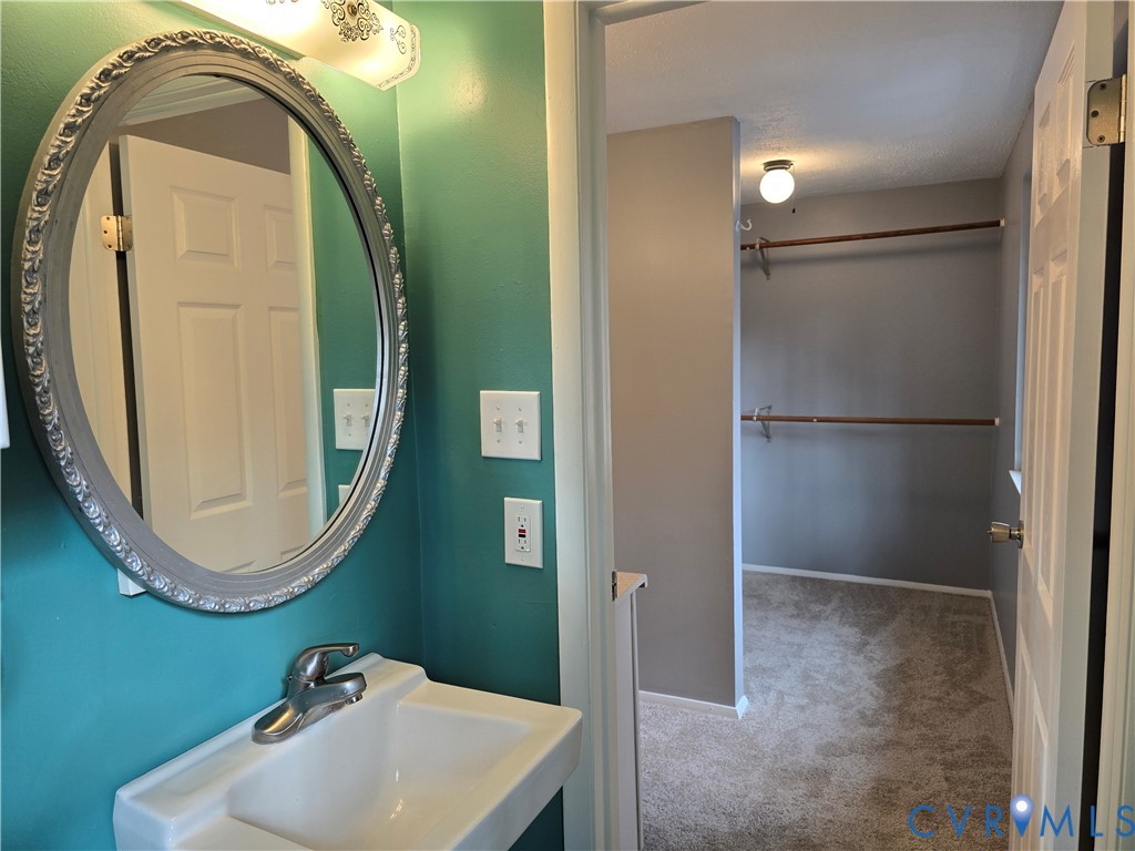4600 Painted Post Lane Midlothian, VA 23112 - Photo 31 of 44 a bathroom with a sink and a mirror