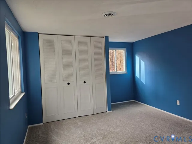 an empty room with windows