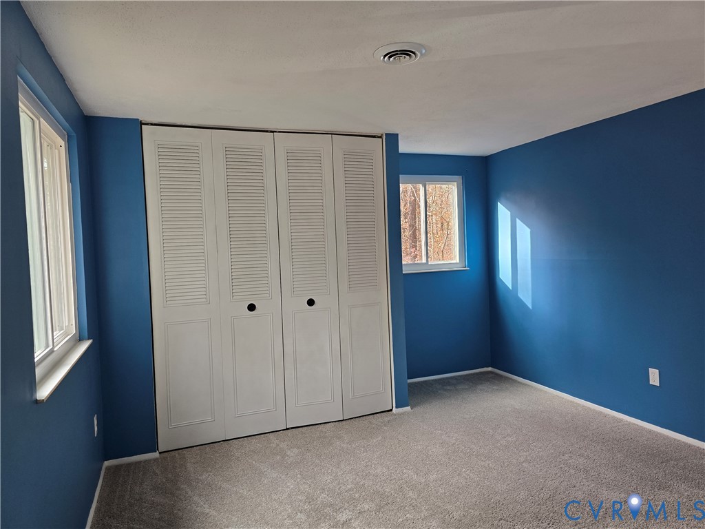 4600 Painted Post Lane Midlothian, VA 23112 - Photo 35 of 44 a view of an empty room with window and stairs