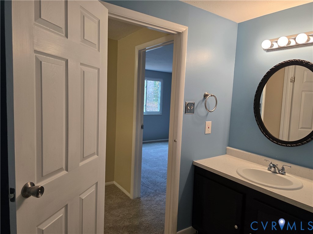 4600 Painted Post Lane Midlothian, VA 23112 - Photo 43 of 44 a bathroom with a sink and a mirror