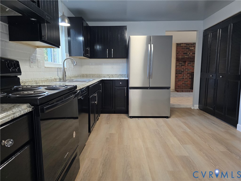 4600 Painted Post Lane Midlothian, VA 23112 - Photo 9 of 44 a kitchen with a sink a stove and refrigerator