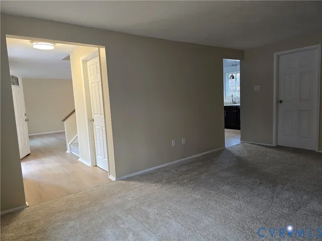 a view of a bathroom with a glass door and a toilet