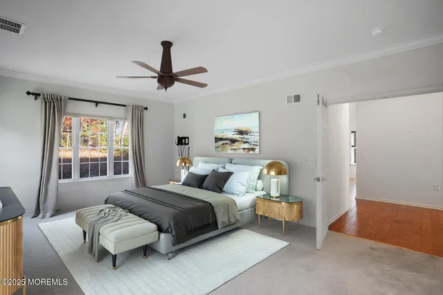 a bedroom with bed and window