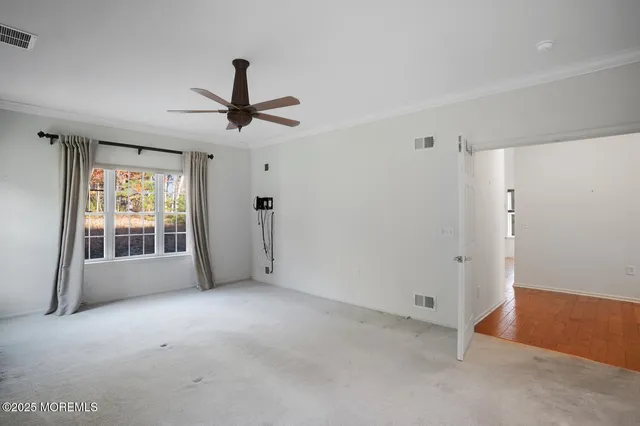 a view of empty room with windows