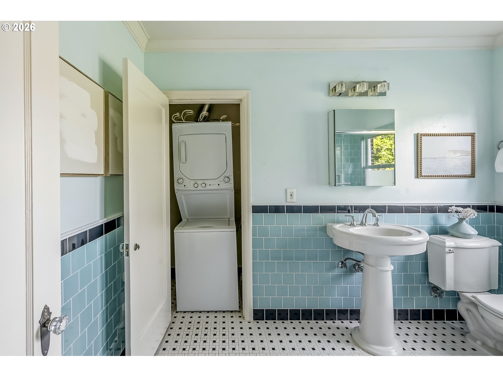 4353 Northeast Halsey Street, Unit 4 Portland, OR 97213 - Photo 12 of 24 a bathroom with a sink a toilet and shower