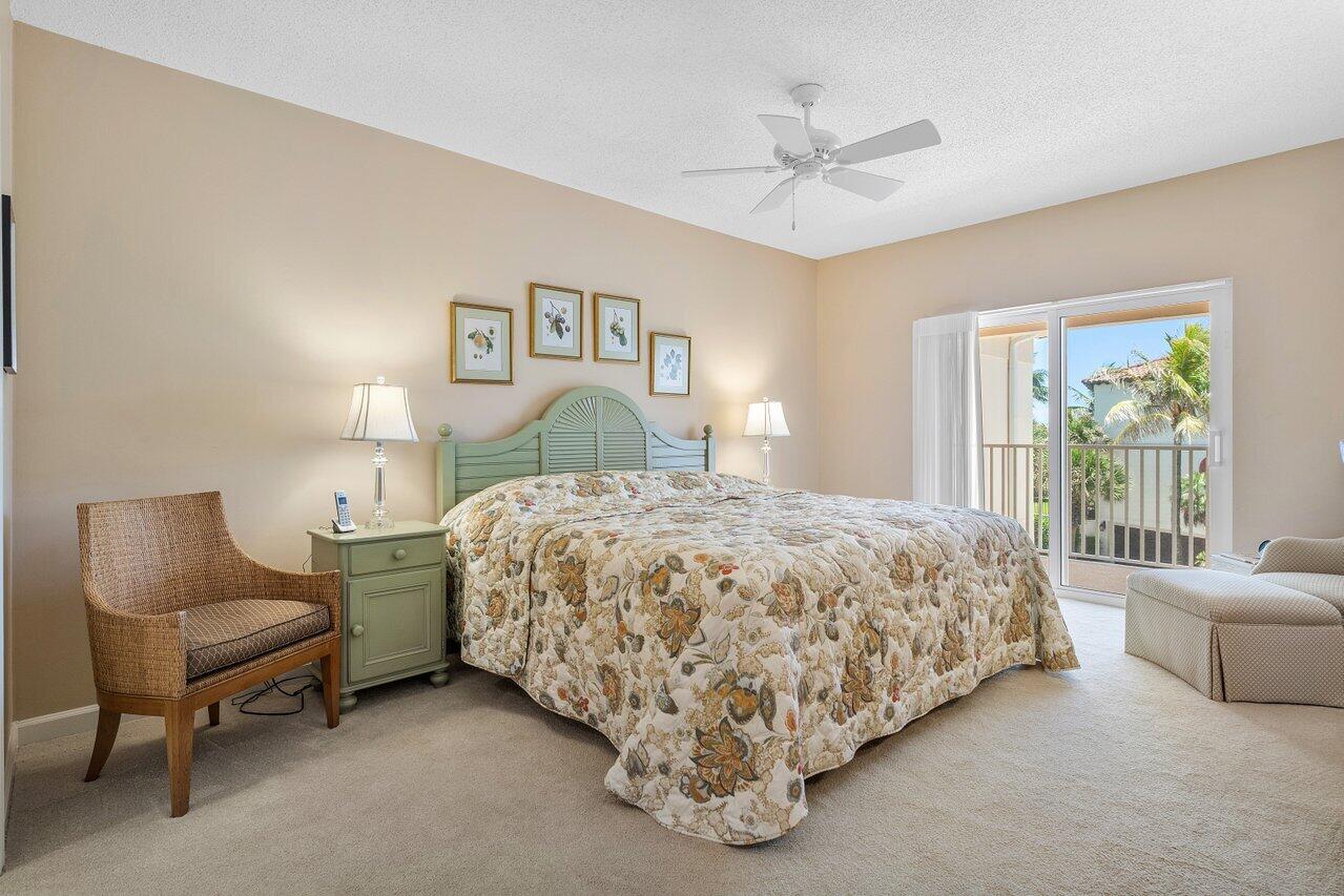 5900 Old Ocean Boulevard, Unit C6 Ocean Ridge, FL 33435 - Photo 11 of 21 a spacious bedroom with a bed and a couch