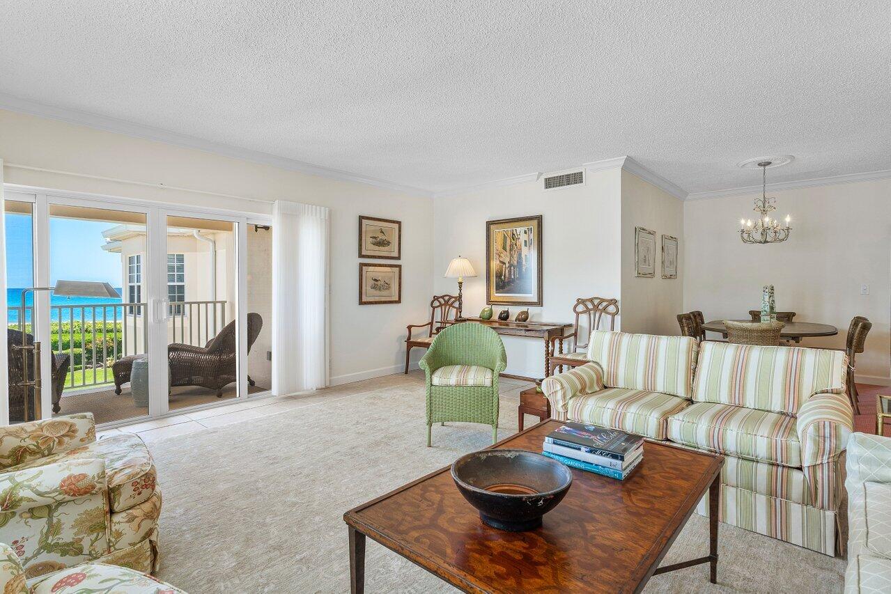 5900 Old Ocean Boulevard, Unit C6 Ocean Ridge, FL 33435 - Photo 15 of 21 a living room with furniture and a table