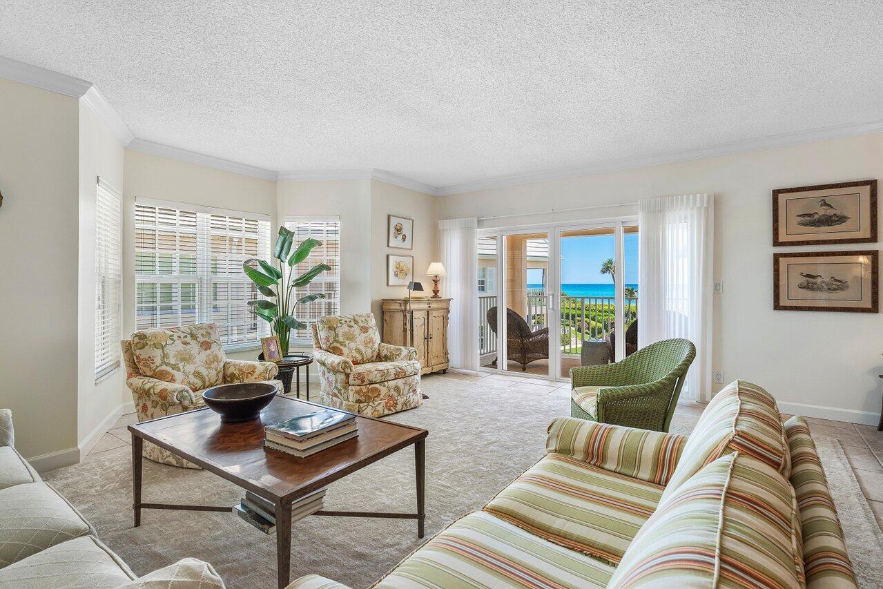 5900 Old Ocean Boulevard, Unit C6 Ocean Ridge, FL 33435 - Photo 16 of 21 a living room with furniture and a potted plant