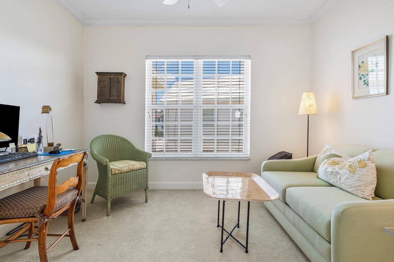 5900 Old Ocean Boulevard, Unit C6 Ocean Ridge, FL 33435 - Photo 9 of 21 a living room with furniture and a flat screen tv