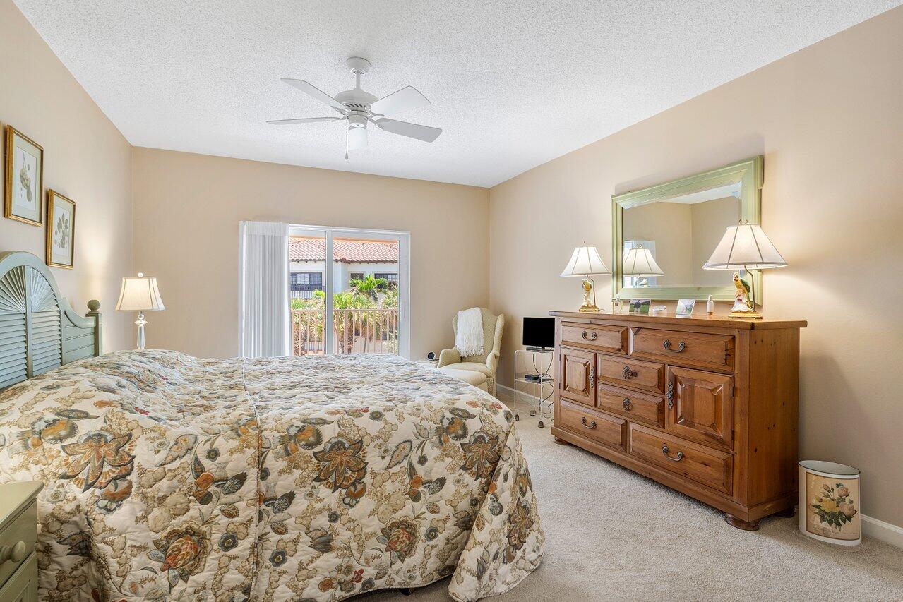 5900 Old Ocean Boulevard, Unit C6 Ocean Ridge, FL 33435 - Photo 10 of 21 a bedroom with a bed and a dresser in it
