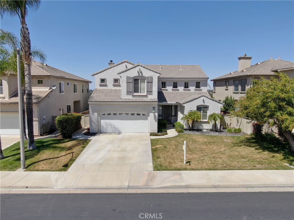 33440 Barrington Drive Temecula, CA 92592 - Photo 1 of 72 a front view of a house with garden