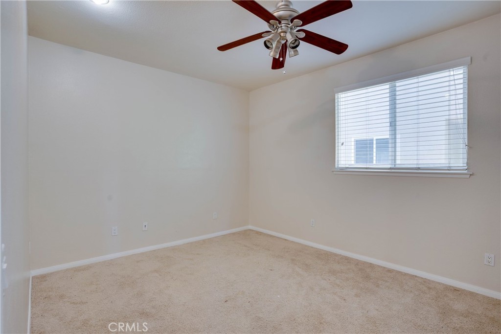 33440 Barrington Drive Temecula, CA 92592 - Photo 24 of 72 an empty room with a window and a fan