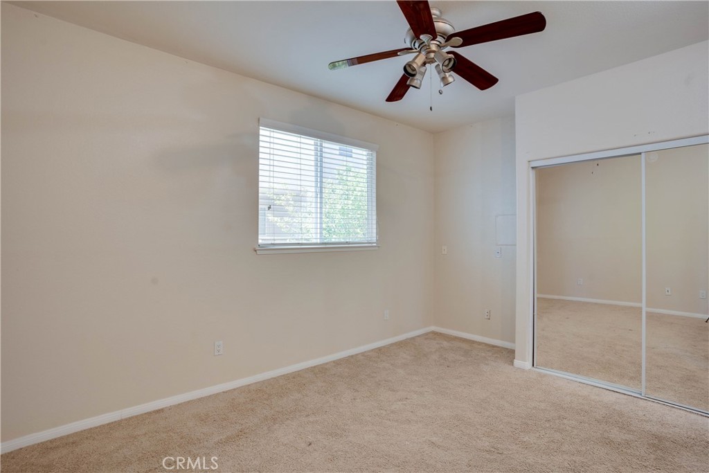 33440 Barrington Drive Temecula, CA 92592 - Photo 25 of 72 an empty room with windows and fan