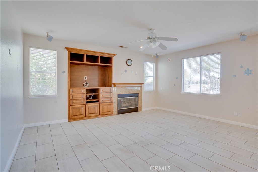 33440 Barrington Drive Temecula, CA 92592 - Photo 27 of 72 an empty room with windows and fireplace