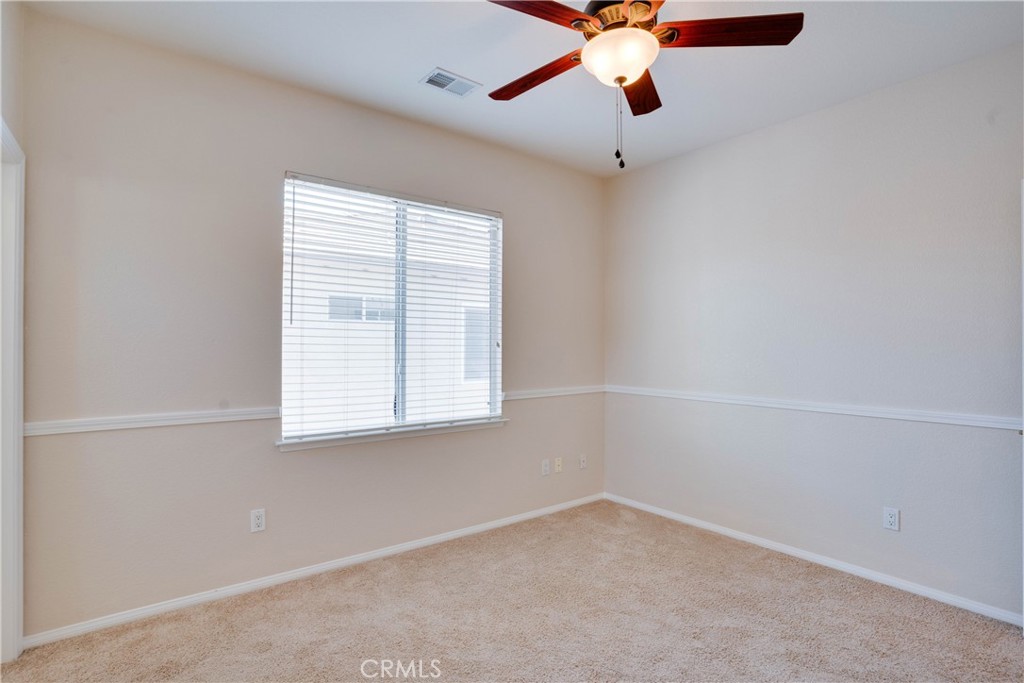 33440 Barrington Drive Temecula, CA 92592 - Photo 56 of 72 an empty room with a window and a fan