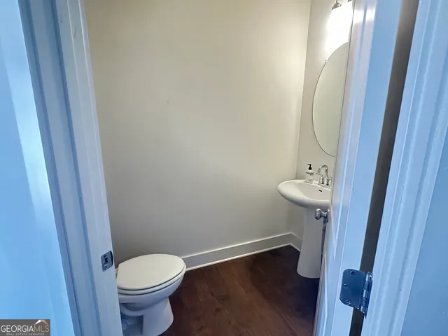 a bathroom with a sink and mirror