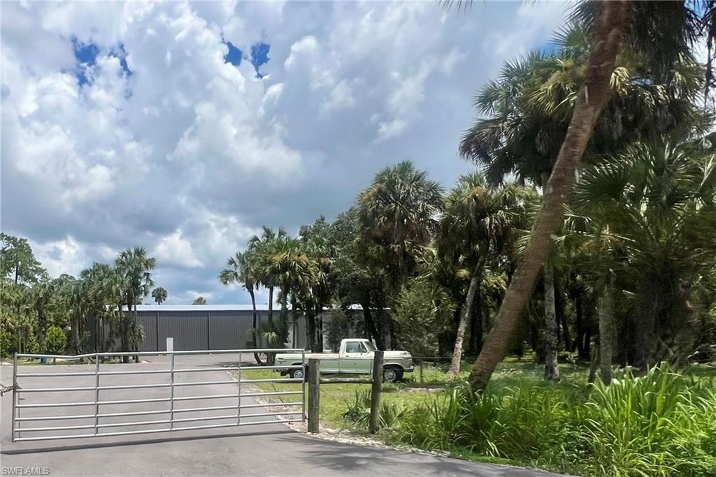 1493 Rock Road Naples, FL 34120 - Photo 6 of 6 a view of a house with a yard